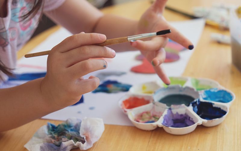 Play and learn students having fun painting, embracing creativity and artistic expression