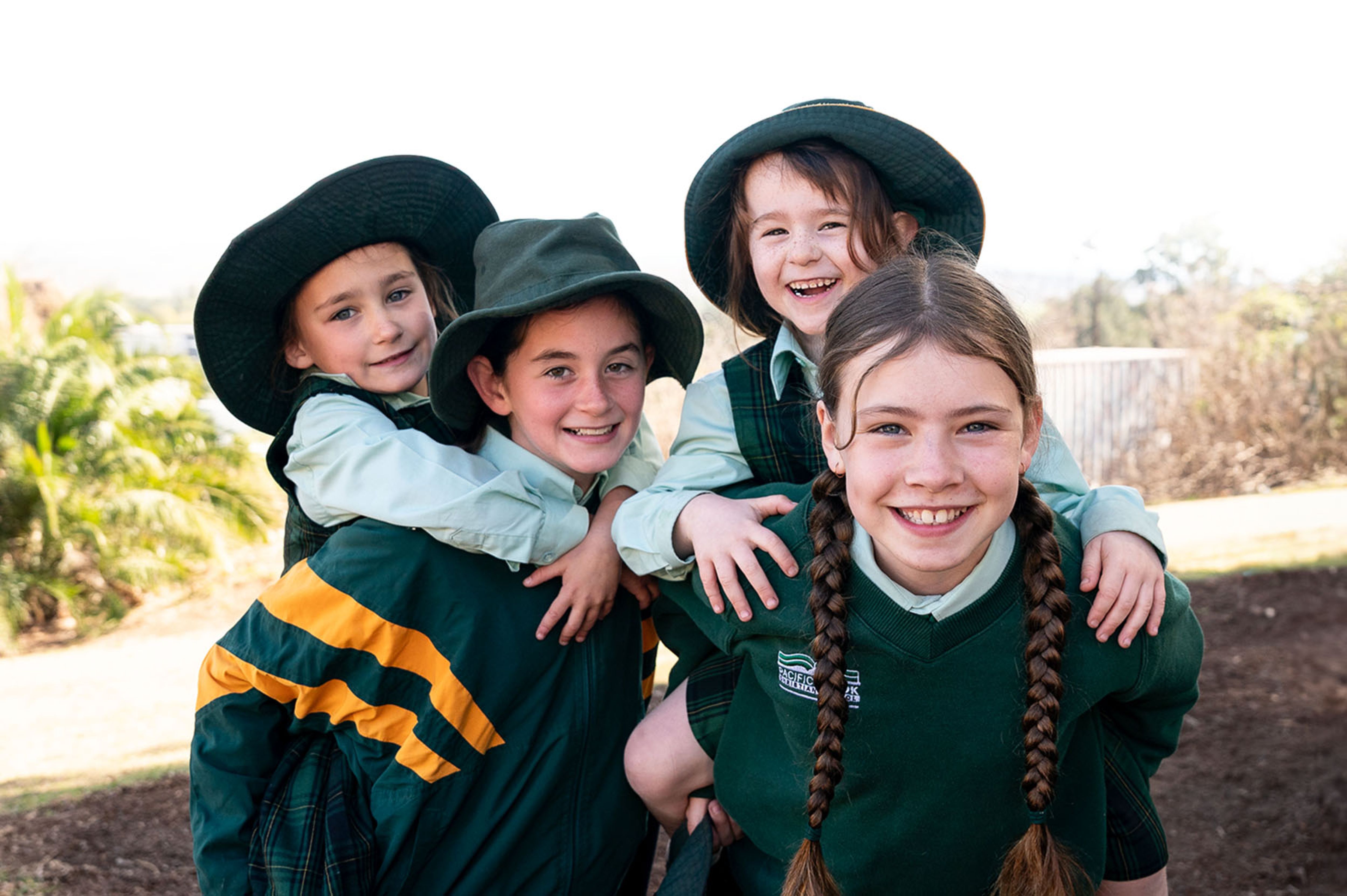 Smiling students playing in the playground