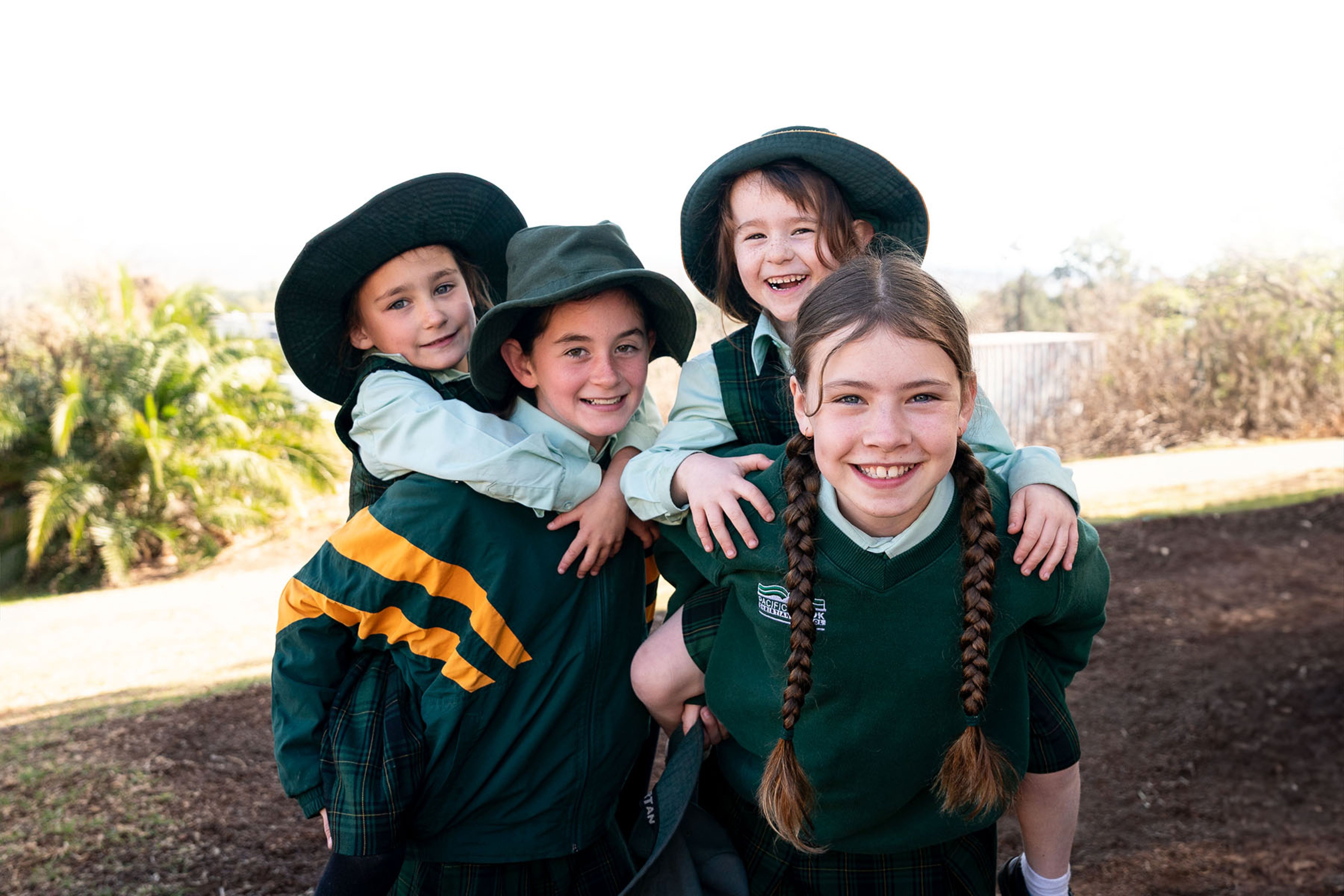 Smiling students playing in the playground